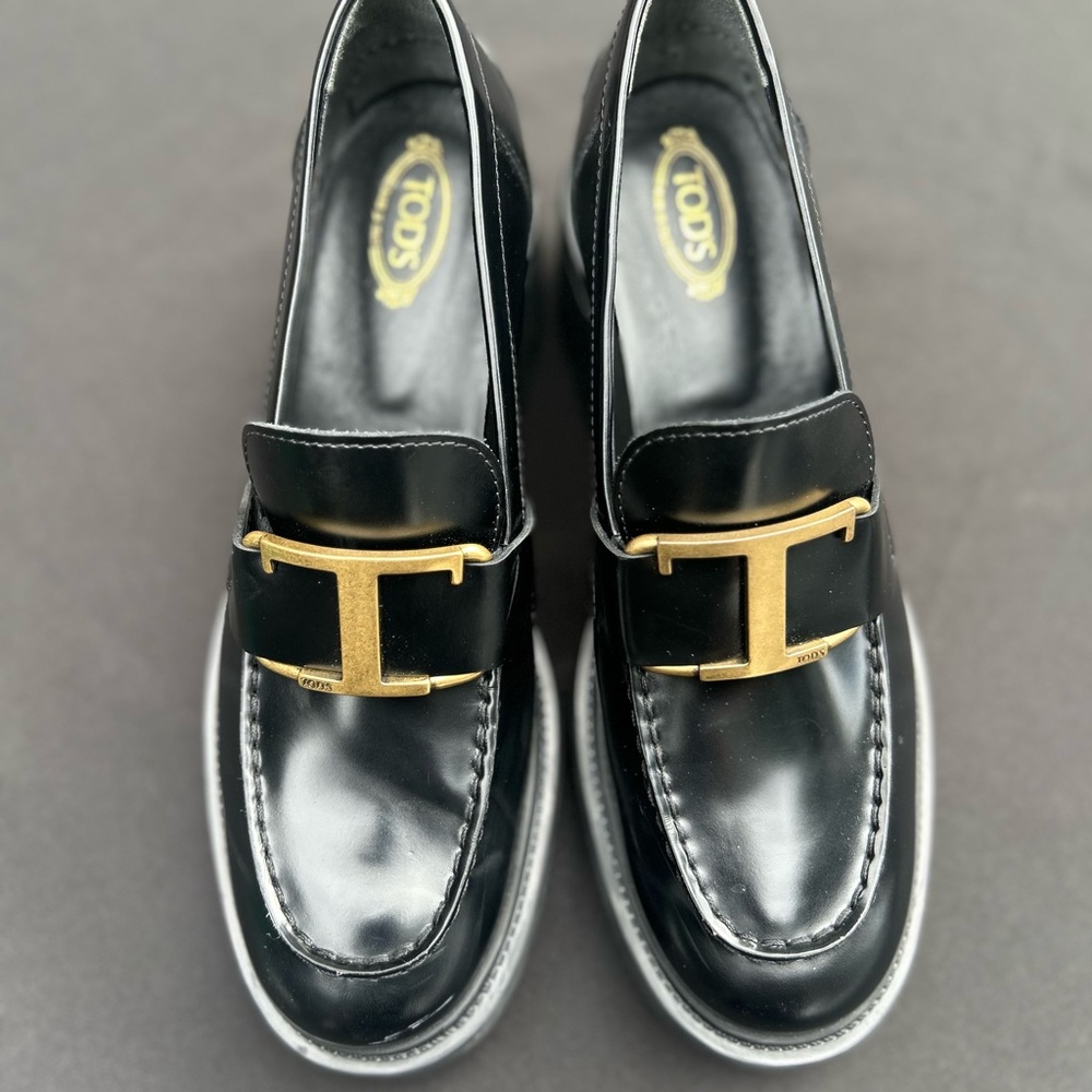 Tod's Black Loafers with Gold Detailing